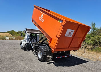 truck with tilting dumpster